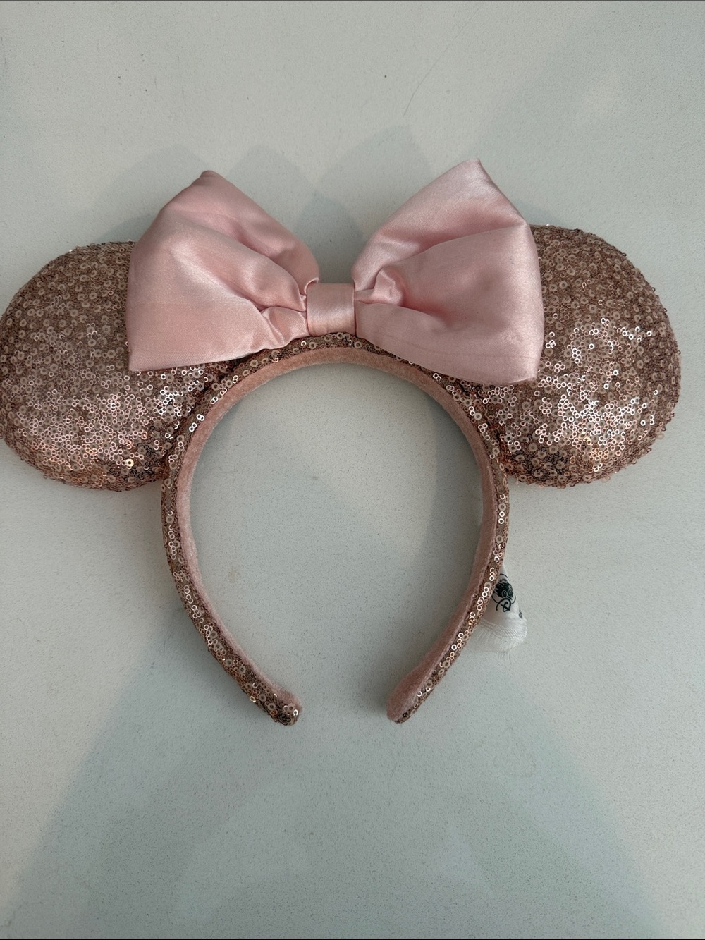 Disney Rose Gold Sequin Minnie Ear Headband with Pink Bow